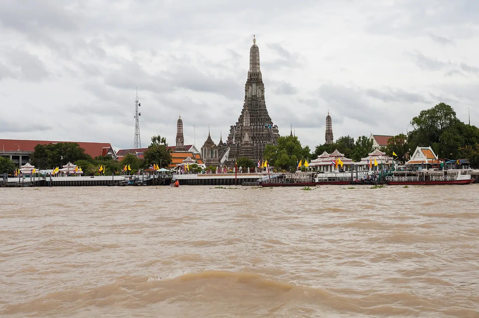 The porcelain-studded spire of Wat Arun on the Chao Phraya river, Bangkok