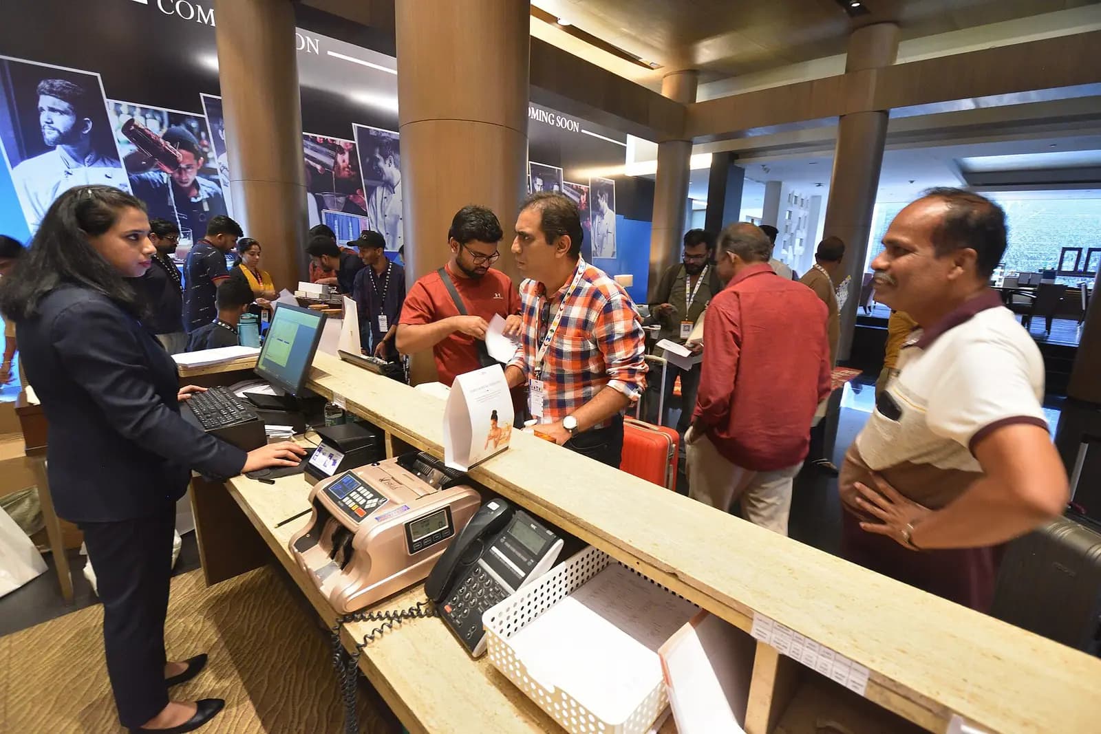 Delegates checking in for a conference at a hotel in Hyderabad, India