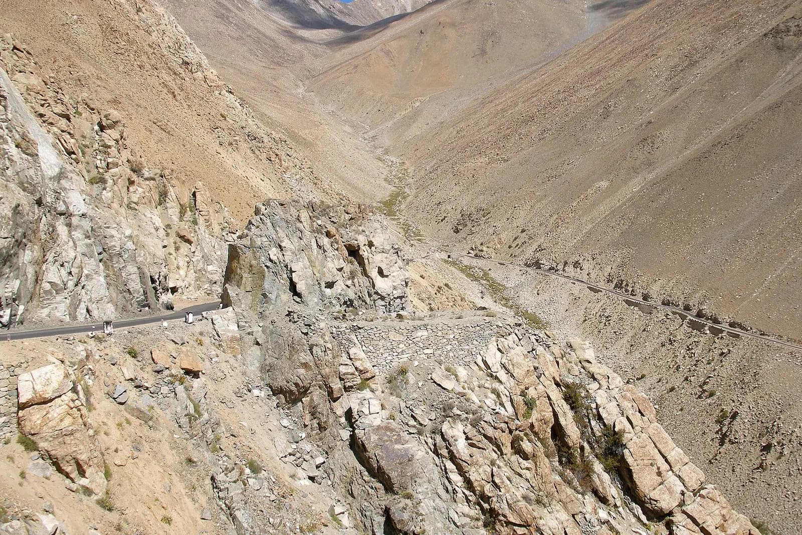 The mountain road climbing over Khardung La pass in Ladakh, in the Indian Himalayas