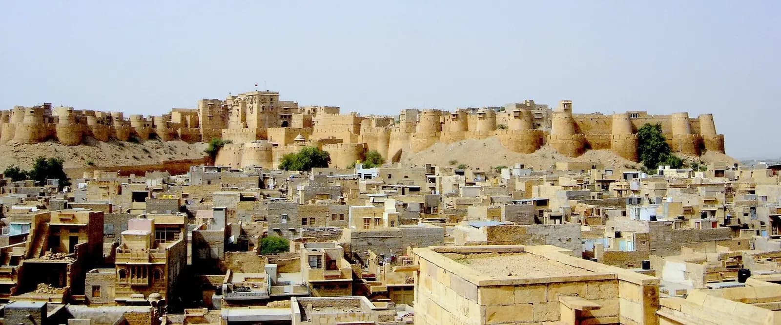 The sandstone bastions of Jaisalmer Fort rising from the desert, Rajasthan
