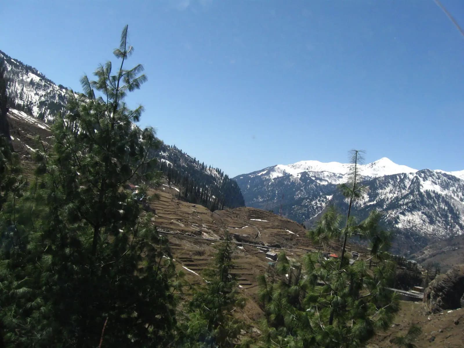 The green bowl of Solang Valley below snow-streaked ridges near Manali, Himachal Pradesh