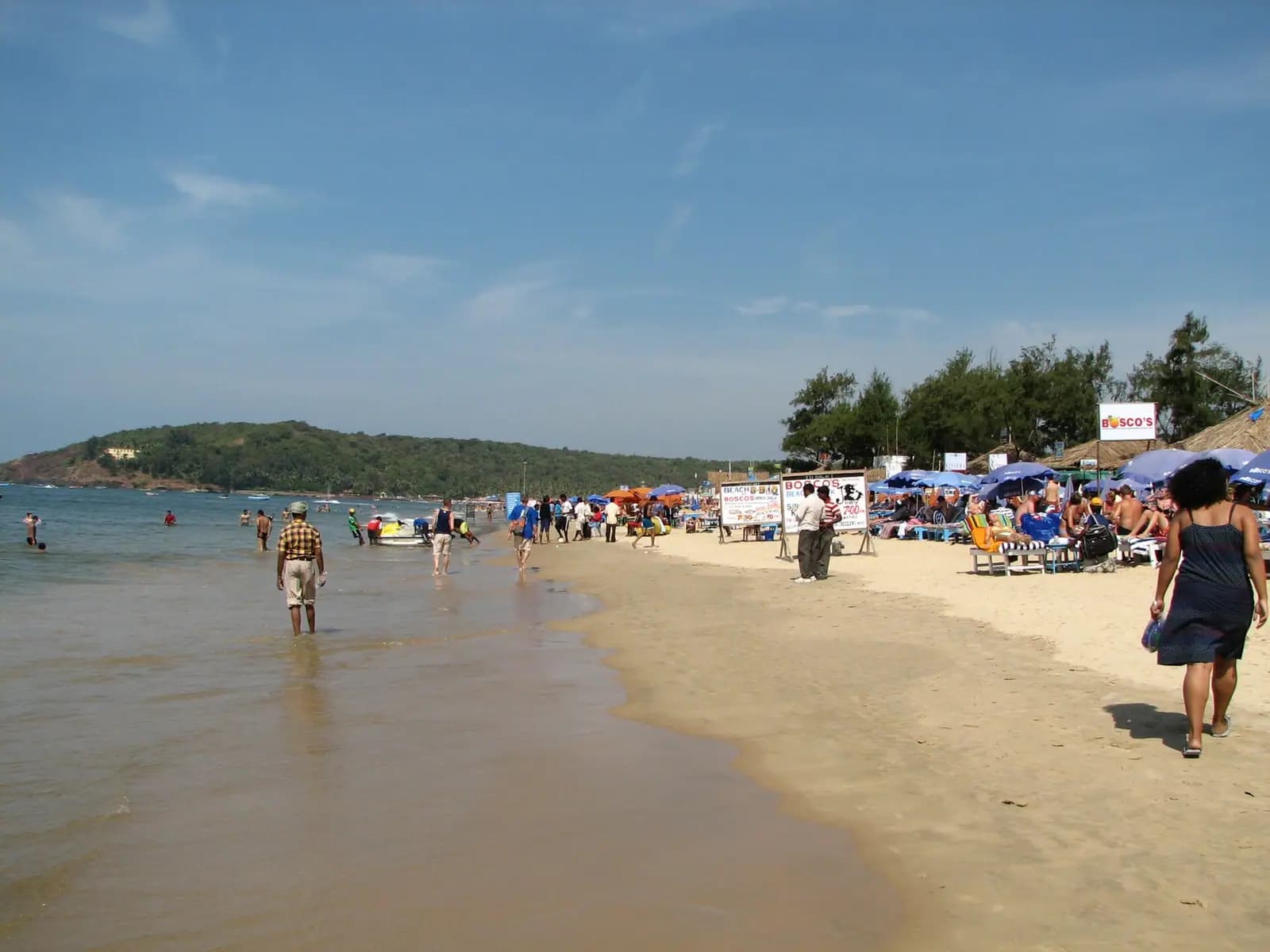 Surf running up the wide sand of Baga beach in North Goa