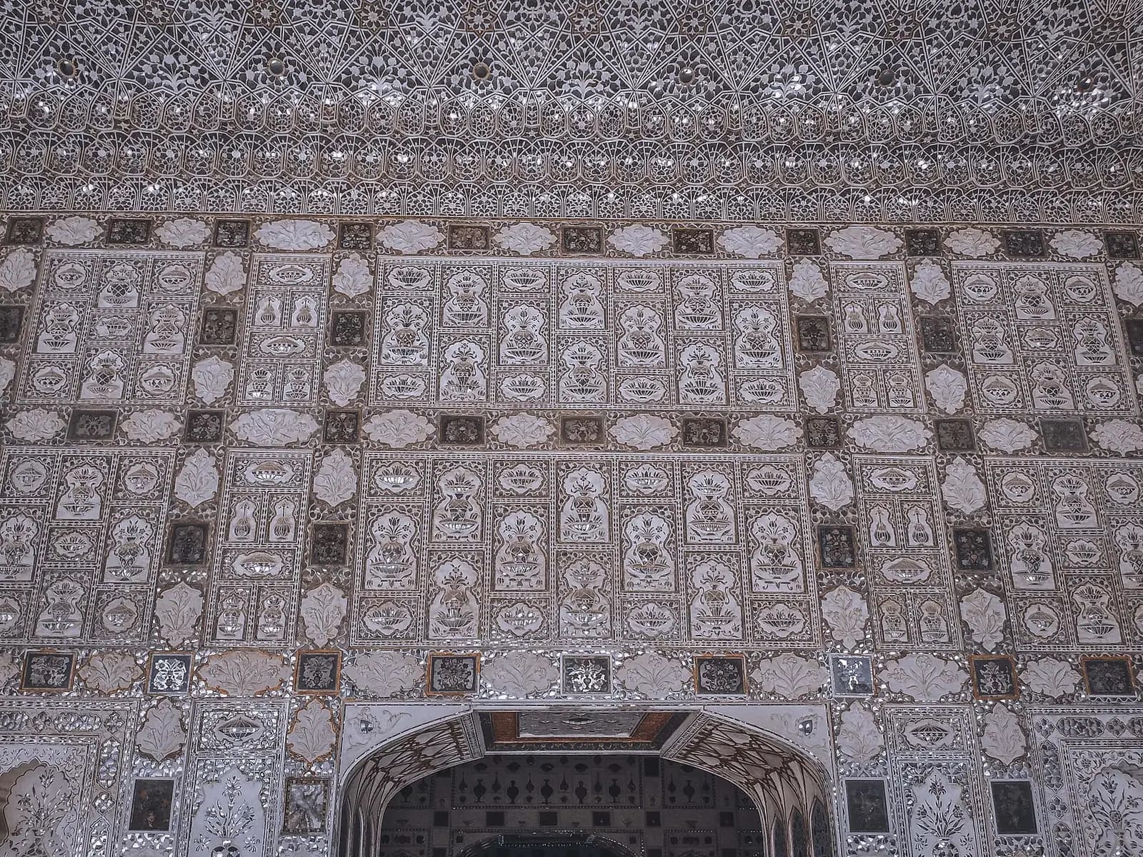 Sandstone fort walls and domes rising over a Rajasthan town