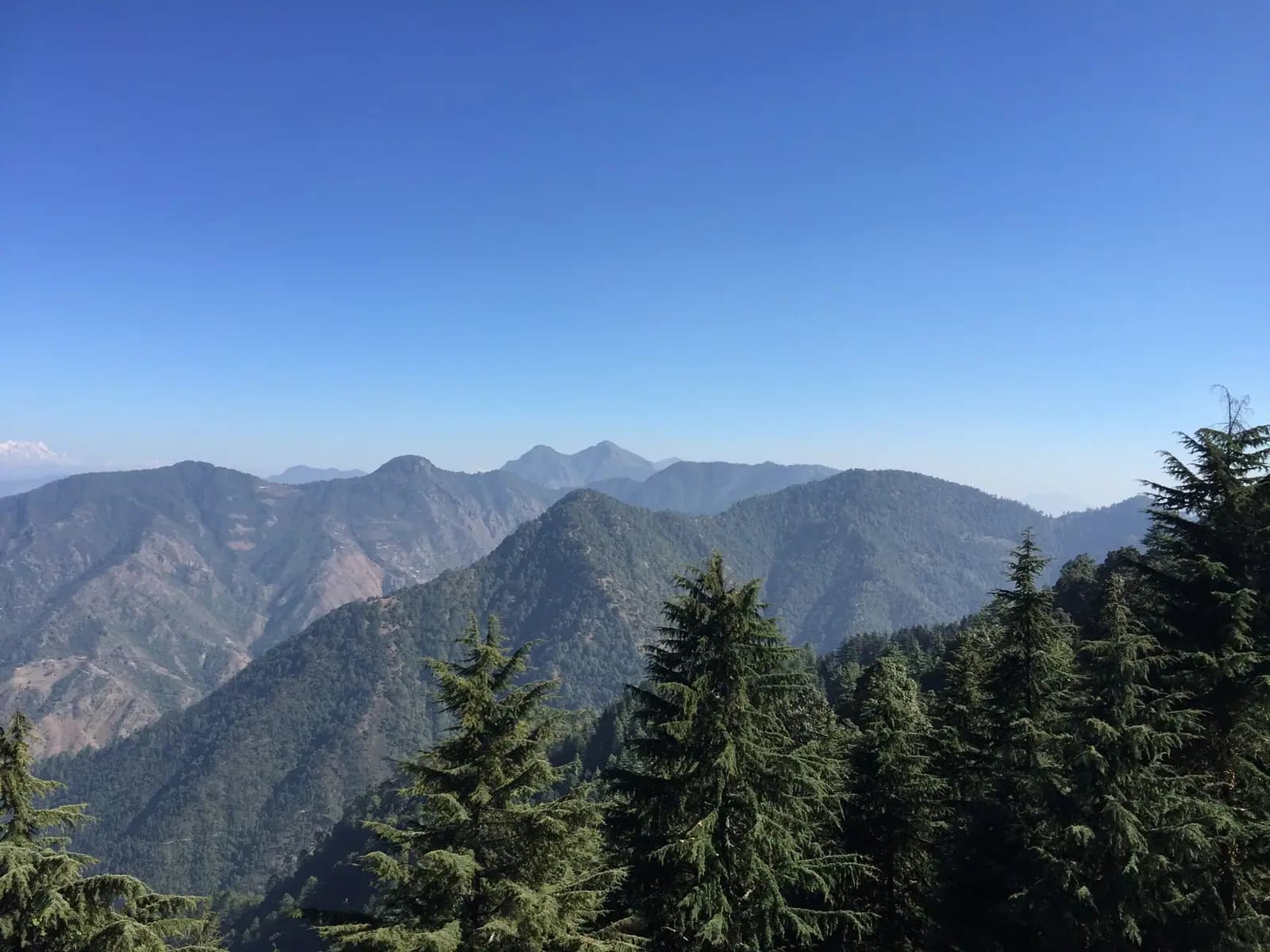 Forested Himalayan ridges and river valleys in Uttarakhand
