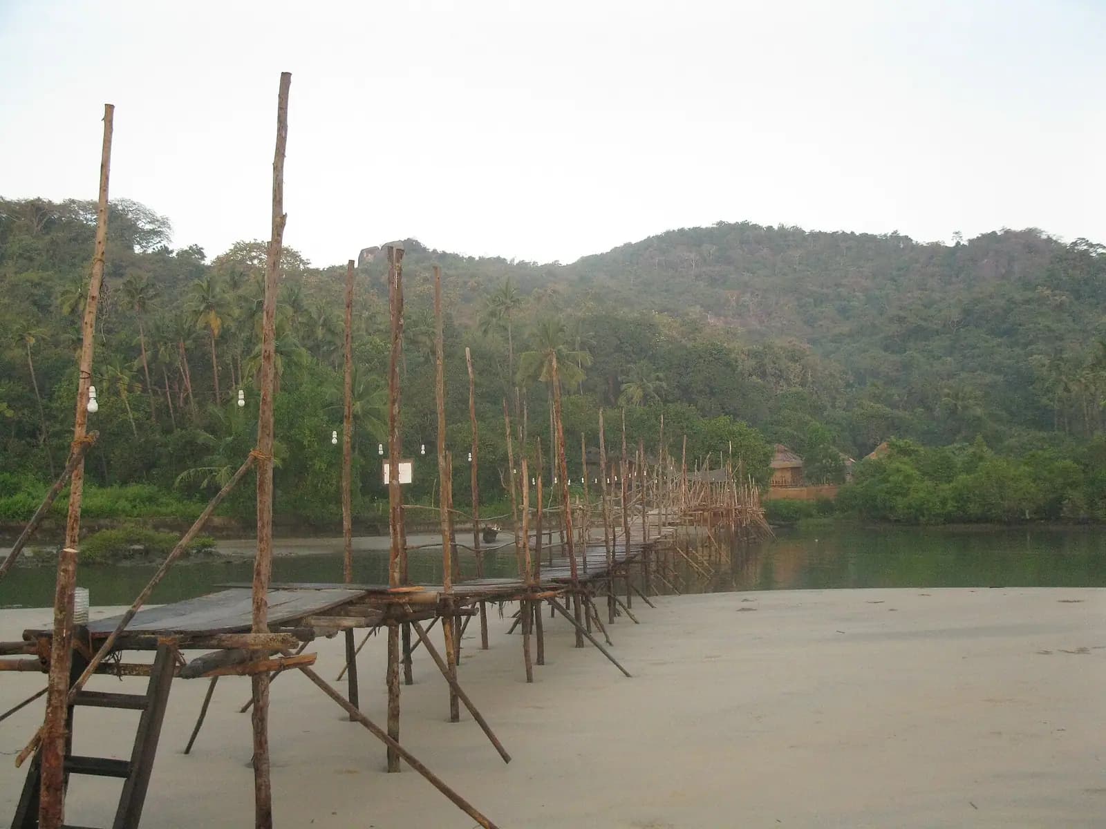 The curving palm-backed bay of Palolem beach in South Goa