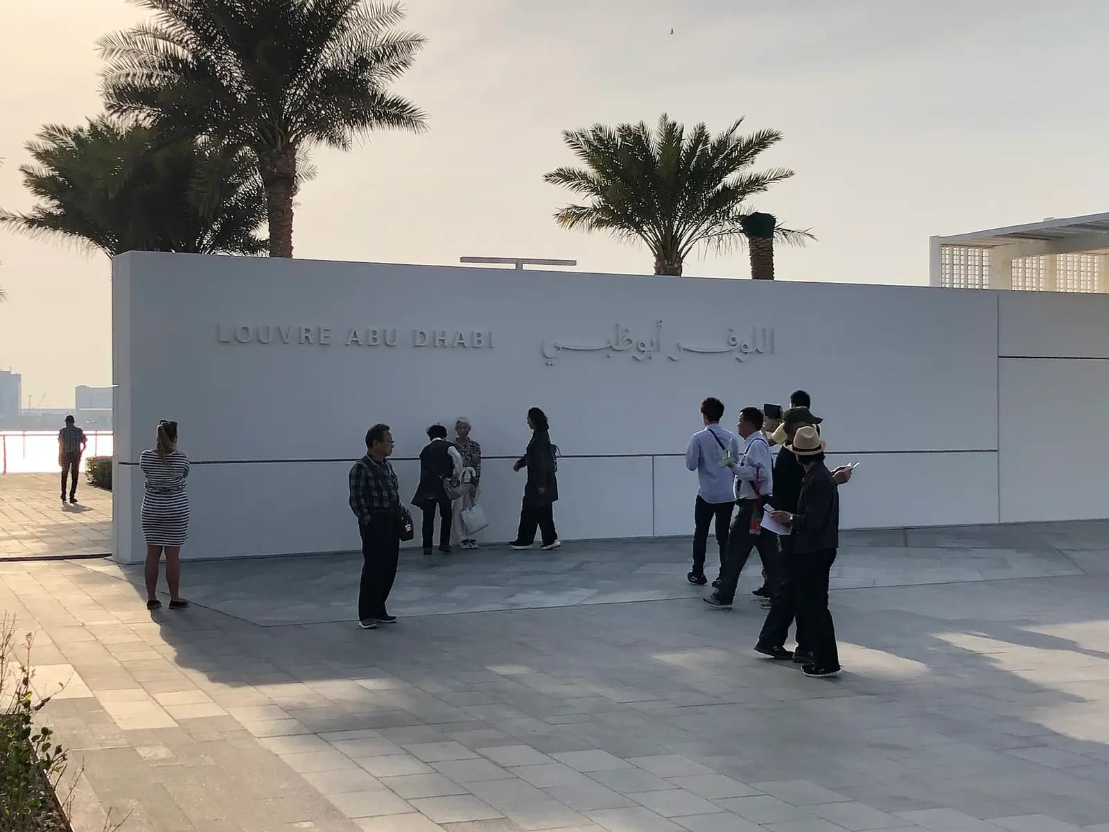 The perforated dome of the Louvre Abu Dhabi over its waterside galleries