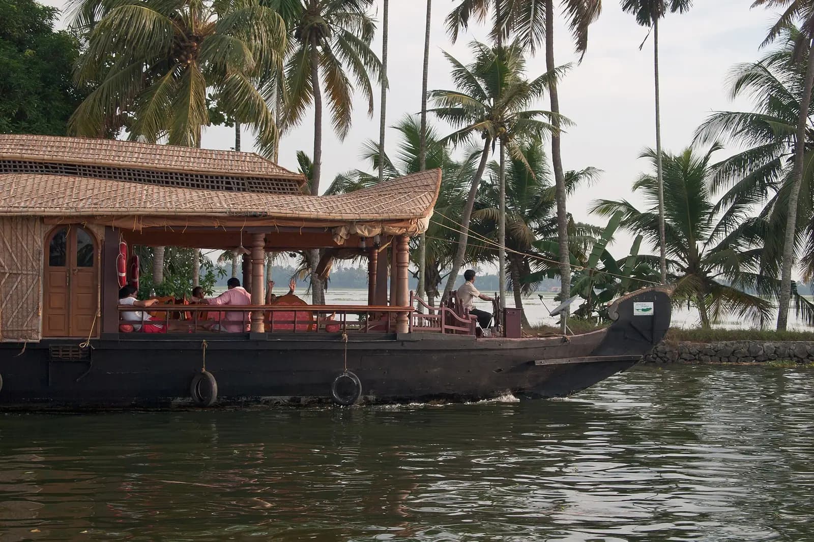 A houseboat cruising the palm-fringed backwaters at Alappuzha, Kerala