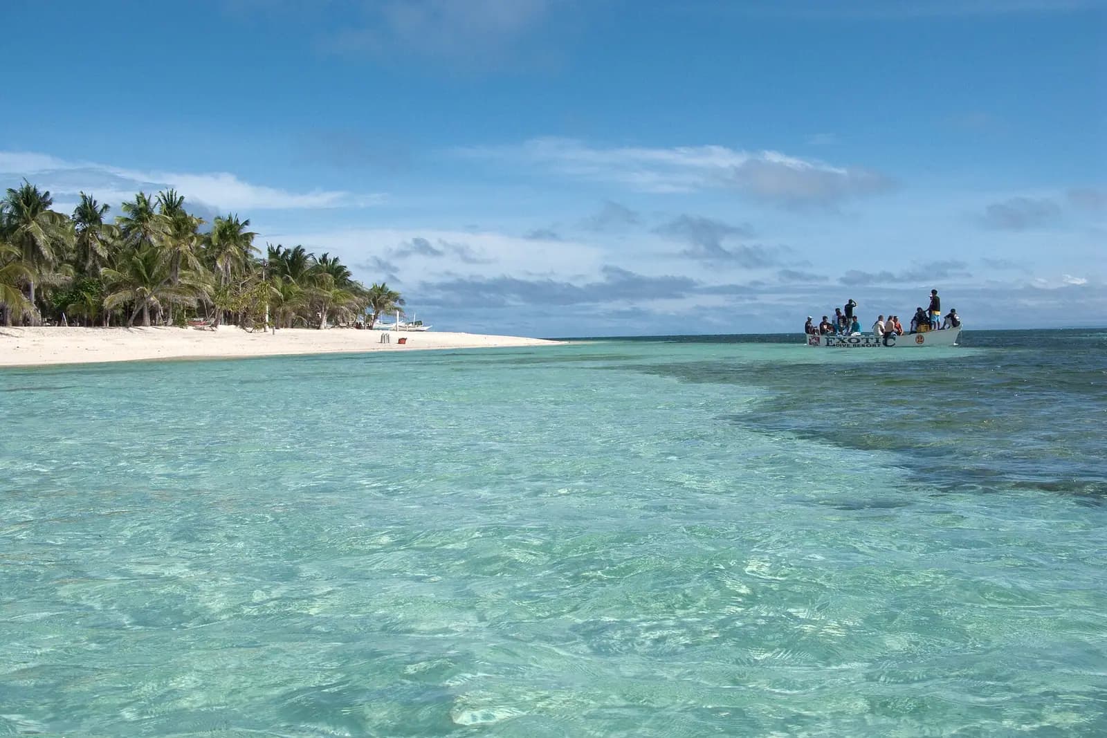 White sand and turquoise shallows on a tropical island beach