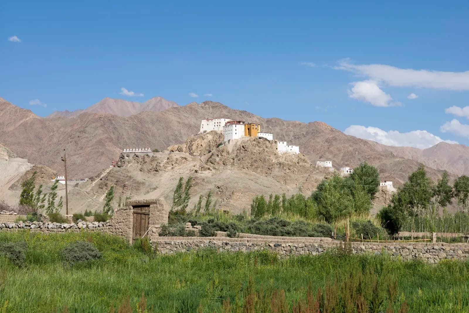 Thiksey Monastery rising in white tiers over the Indus valley in Ladakh