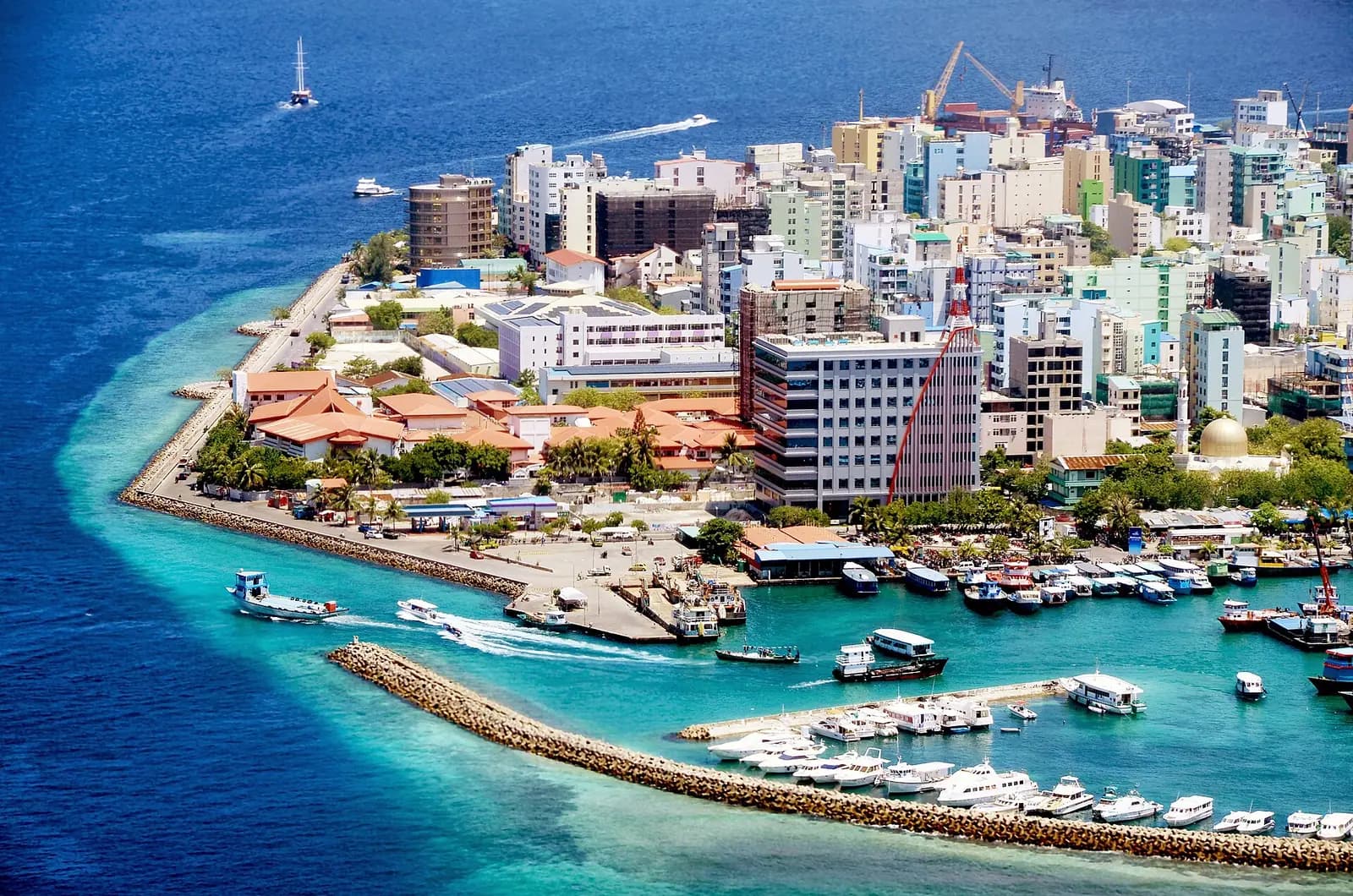 The dense island city of Malé surrounded by reef water, Maldives