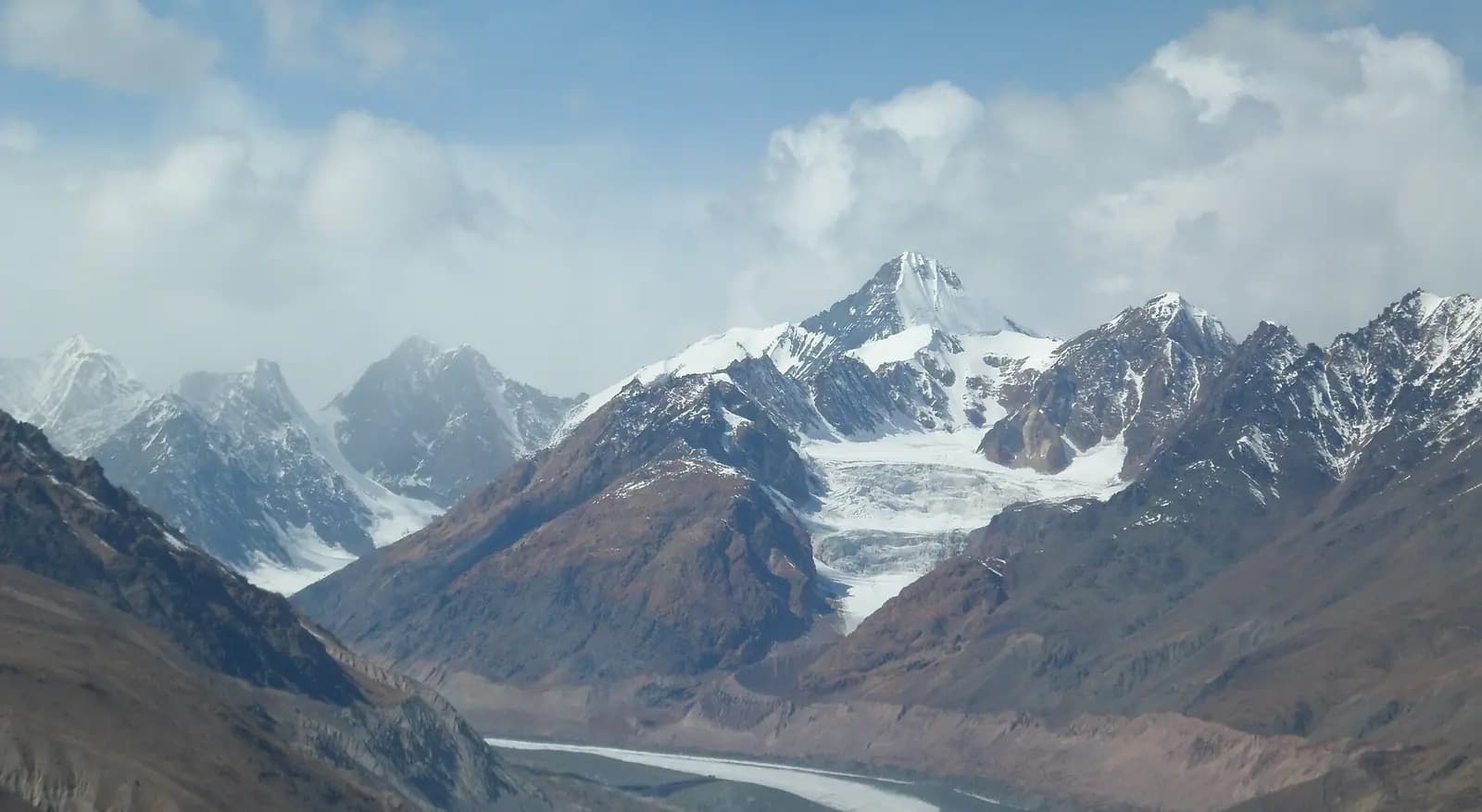 The town of Kaza spread along the Spiti river under bare mountain slopes